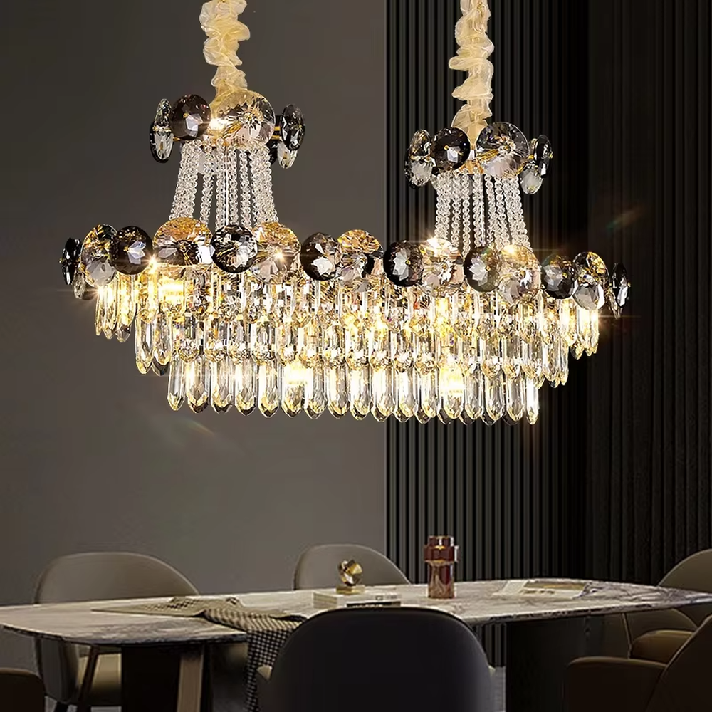 This is a luxurious classical multi-layer crystal chandelier, combining transparent and smoky gray crystals with a multi-layer hanging design. It features brilliant lighting and grand luxury. It is used for space lighting and decoration, creating a luxurious and noble atmosphere. Suitable for luxury living rooms, high-end hotel lobbies, villa banquet halls and other places.