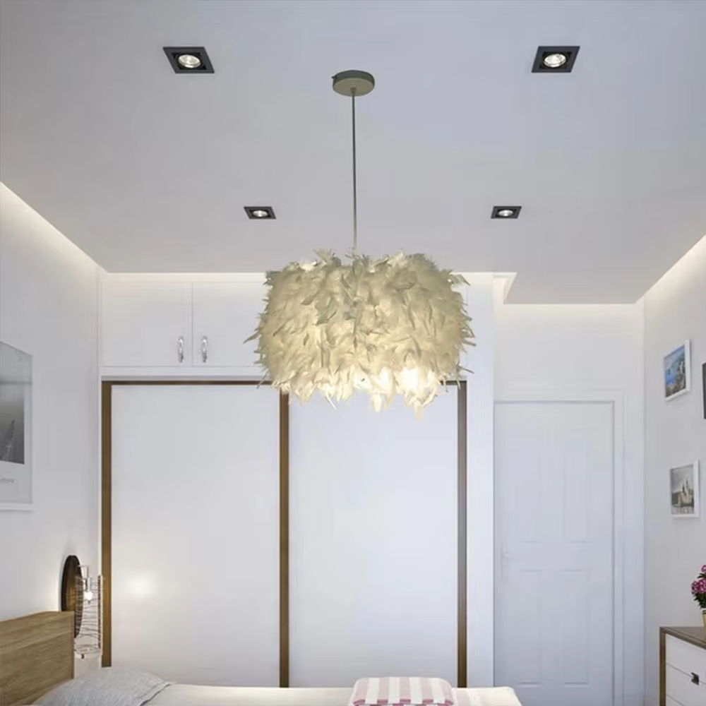 Dreamy feather spherical chandelier (pure white feather lampshade + thin hanging wire), warm light effect, creating a soft and healing space atmosphere.