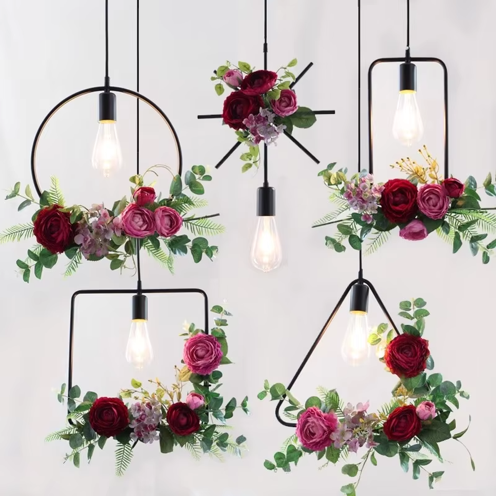 This is a natural and fresh floral metal chandelier, including two styles of golden circular and radial metal frames, paired with artificial green plants, flowers and transparent bulbs. It features a natural and romantic design with warm and soft lighting. It is used for space lighting and decoration, creating a natural and romantic atmosphere. Suitable for Nordic-style homes, literary cafes, wedding venues, art homestays and other places.