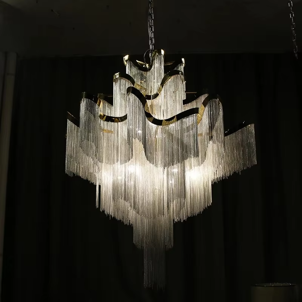 Modern light luxury silver frame crystal tassel irregular-shaped chandelier, warm light effect, creating a luxurious artistic atmosphere.