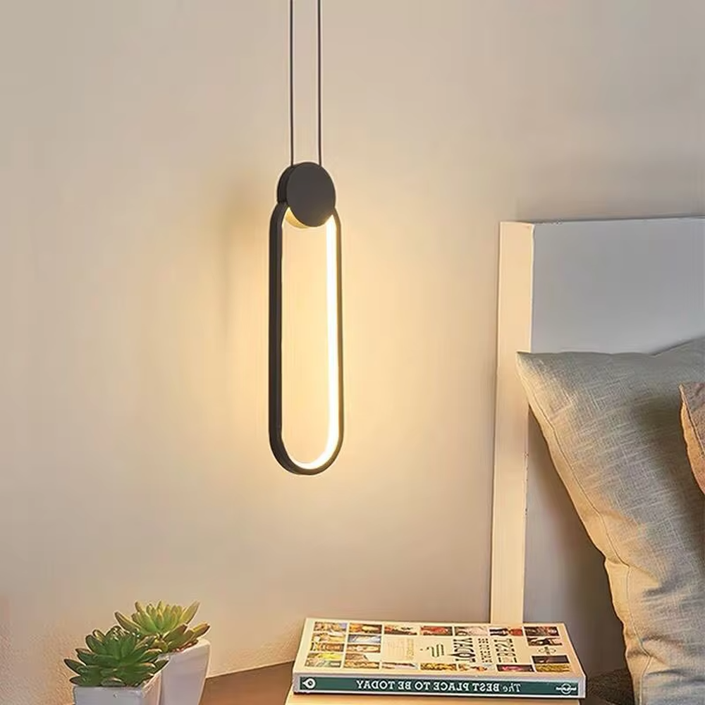 Modern minimalist elliptical ring LED chandelier, suspended elliptical shape made of black metal frame, built-in linear light source with soft and uniform light, designed to enhance the minimalist atmosphere of spaces, suitable for bedroom bedside, entrance, light luxury homes and commercial spaces