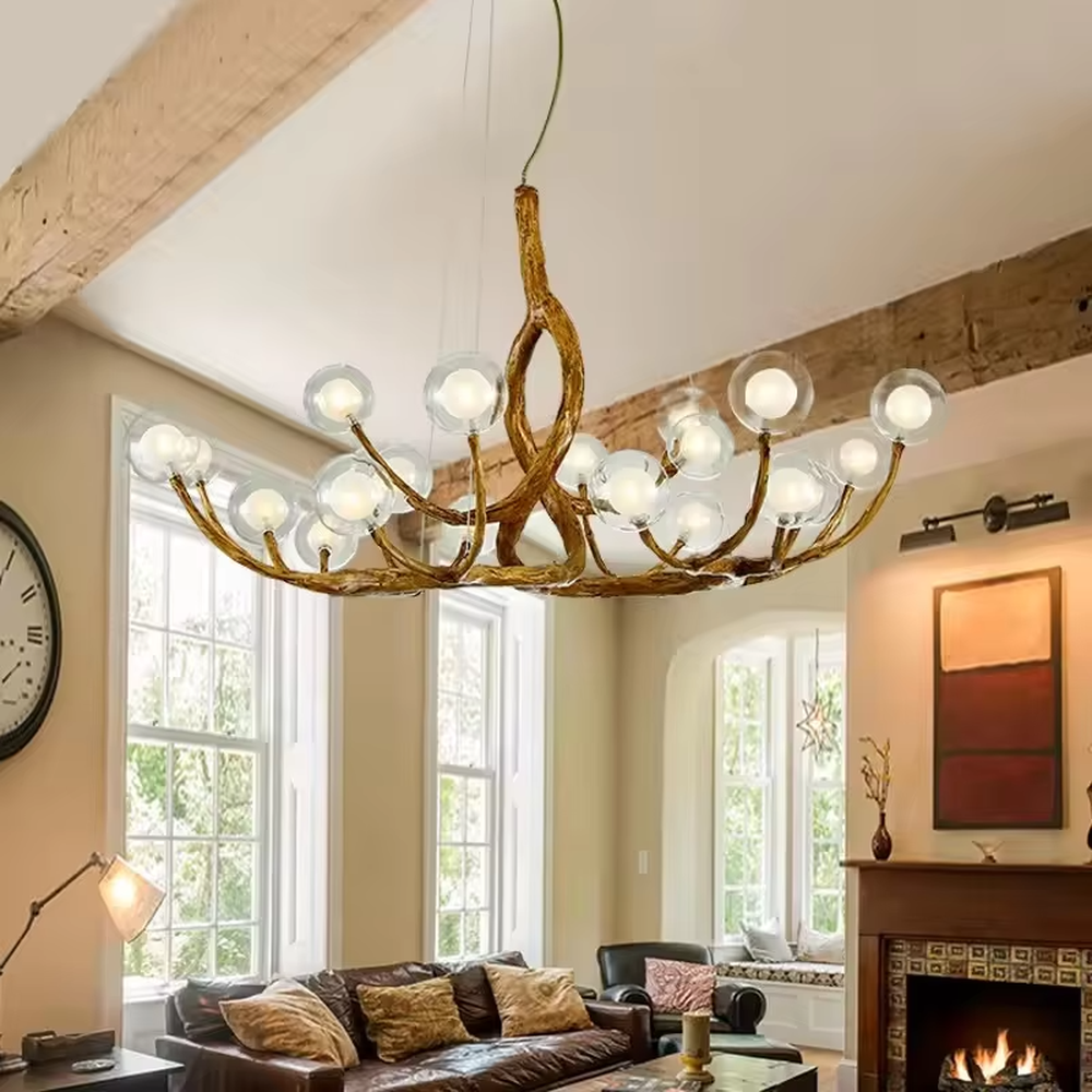 This is a luxury natural-style branch-shaped chandelier with golden metal branch-like brackets and multiple transparent spherical lampshades. It features a highly artistic design with a natural luxury ambiance. It is used for space lighting and decoration, creating a natural artistic visual focus. It is suitable for luxury-style home living rooms, art villa spaces, high-end music rooms and other places.