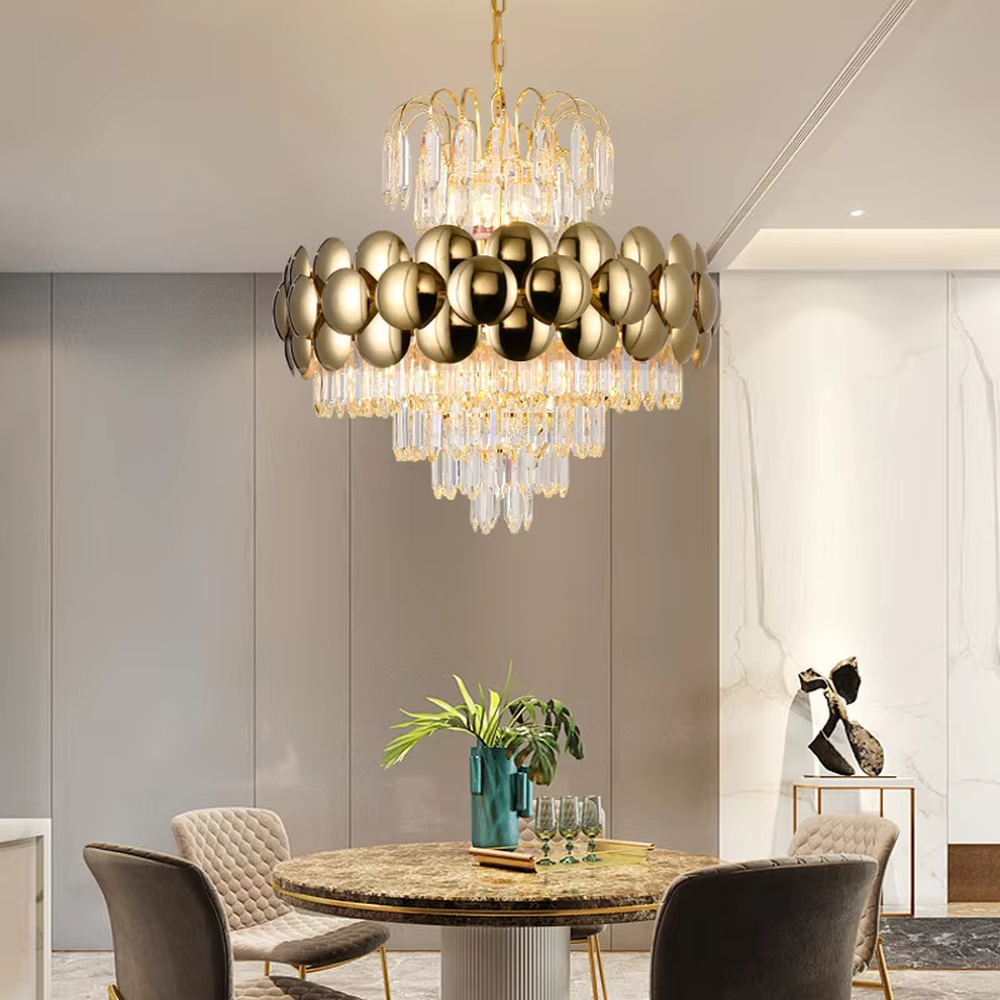 This is a luxurious modern-style golden spherical crystal multi-layer chandelier, combining golden metal spherical elements with multi-layer crystals. It features a grand and luxurious design with brilliant lighting. It is used for space lighting and decoration, creating a high-end luxurious atmosphere. Suitable for light luxury-style restaurants, luxury living rooms, high-end hotel banquet halls and other places.