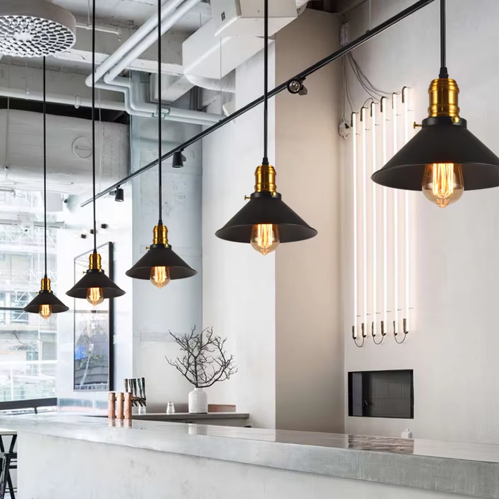Industrial style black-gold three-head cone chandelier, with black iron lampshades and gold metal top details, embedded with retro Edison bulbs, providing warm and atmospheric light, used for lighting and decoration in dining tables, bars and other areas, suitable for industrial, modern minimalist home and commercial spaces
