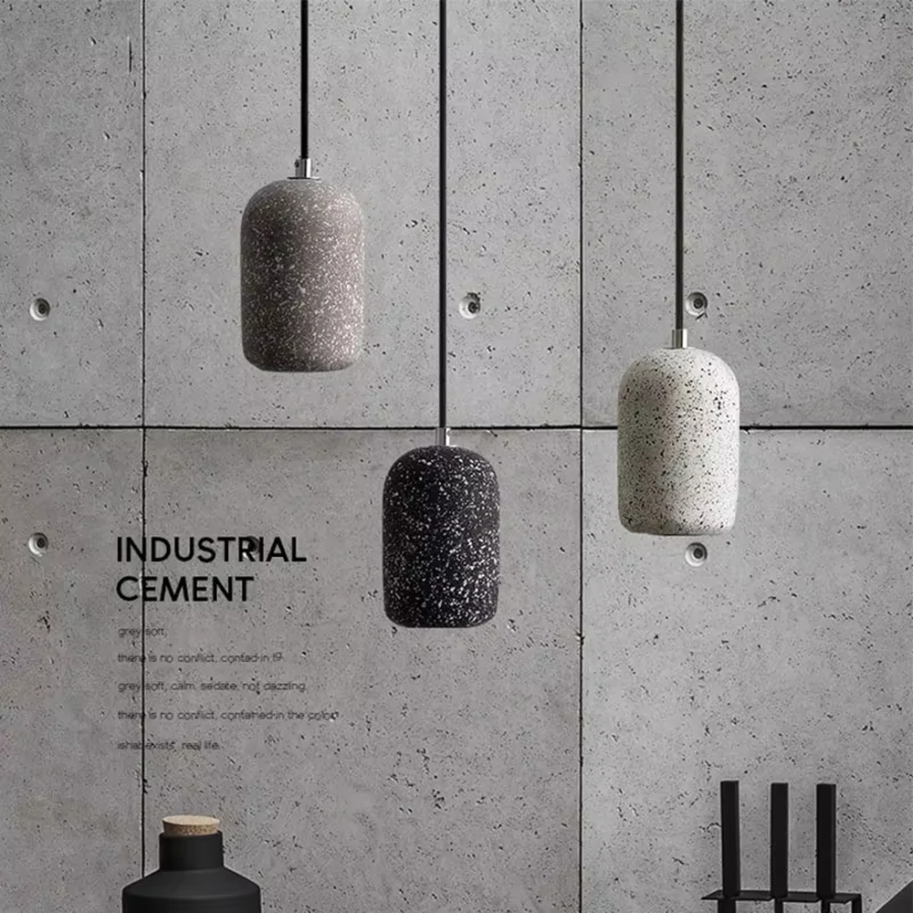 Industrial style speckled cement cylinder multi-head pendant light (multi-color), warm light effect, creating a minimalist industrial style atmosphere.