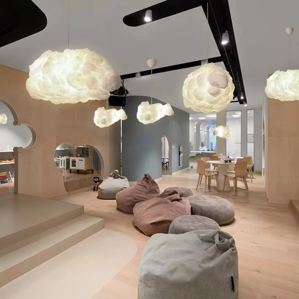 This dreamy cloud-shaped chandelier is made of fluffy fiber/fabric material, simulating the shape of real clouds, transmitting light softly and hung in varying sizes. It serves both lighting and decorative purposes, ideal for Internet celebrity restaurants, cafes, children's rooms, cultural and creative spaces and other scenarios.