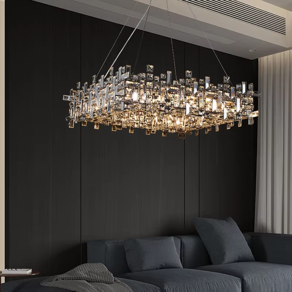 This is a modern luxurious rectangular crystal block combination chandelier, composed of a large number of transparent cut crystal blocks irregularly spliced into a rectangular shape, paired with a metal frame. The light through the crystals is brilliant and bright, creating a high-end modern luxurious atmosphere.