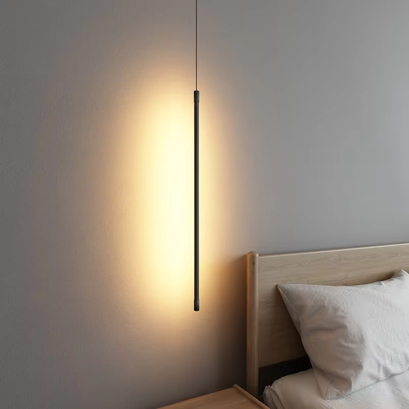 This minimalist linear chandelier features a slender black metal lamp body with a floating suspension design, emitting soft diffused light, serving both lighting and decorative purposes, ideal for bedroom bedside tables, living room feature walls, modern minimalist homes and other scenarios.