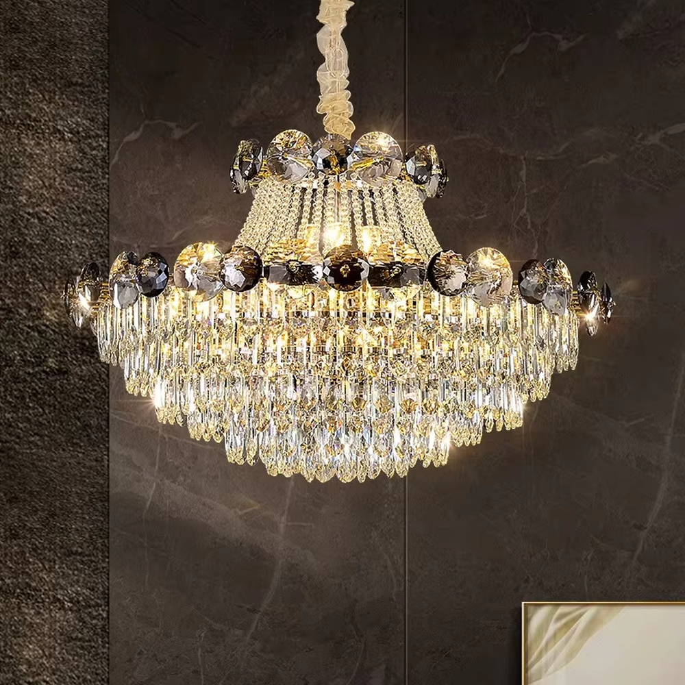This is a luxurious classical multi-layer crystal chandelier, combining transparent and smoky gray crystals with a multi-layer hanging design. It features brilliant lighting and grand luxury. It is used for space lighting and decoration, creating a luxurious and noble atmosphere. Suitable for luxury living rooms, high-end hotel lobbies, villa banquet halls and other places.