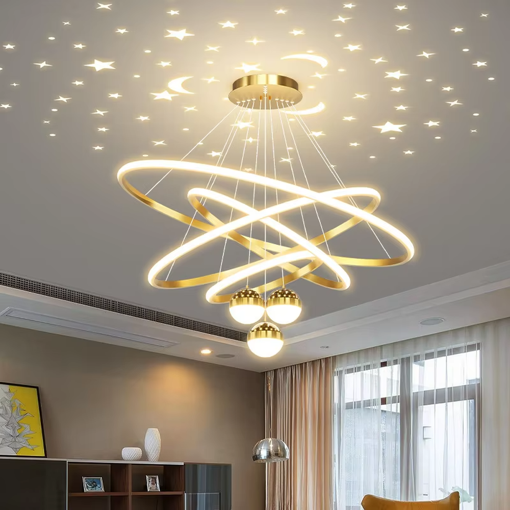 This modern light luxury galaxy-shaped chandelier features multi-layer interlaced ring light strips made of gold metal, paired with spherical crystal lamp shades, and has a built-in starry sky projection effect on the top. It serves both lighting and decorative purposes, ideal for modern home spaces such as living rooms and dining rooms, as well as light luxury commercial venues.