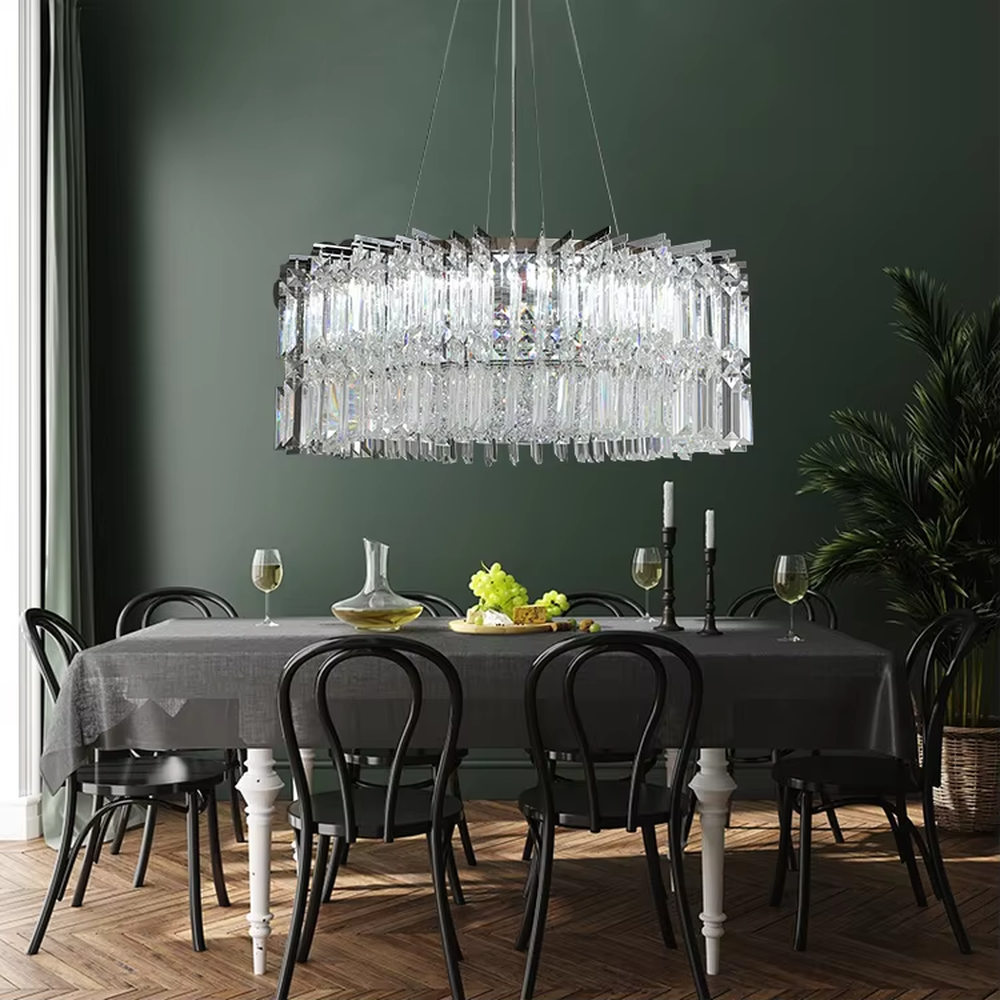 Luxury rectangular crystal chandelier (multi-faceted cut crystals + polished metal), warm light effect, creating a brilliant and high-end light luxury space atmosphere.