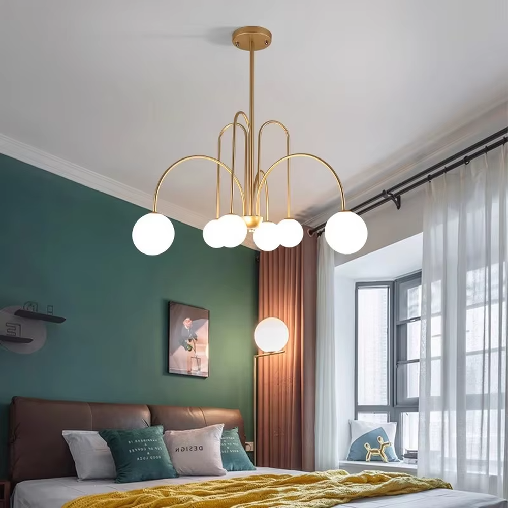 Light luxury gold arc glass ball chandelier (gold arc frame + milk-white glass balls), warm light effect, creating a soft and high-end home atmosphere.