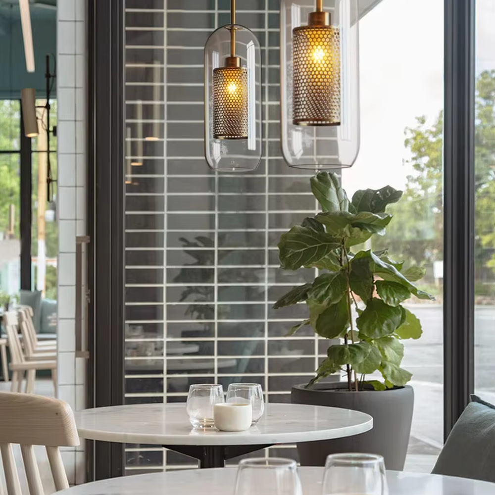 Modern light luxury golden mesh shade glass ball chandelier (multi-size combination), warm light effect, creating an exquisite layered minimalist space atmosphere.