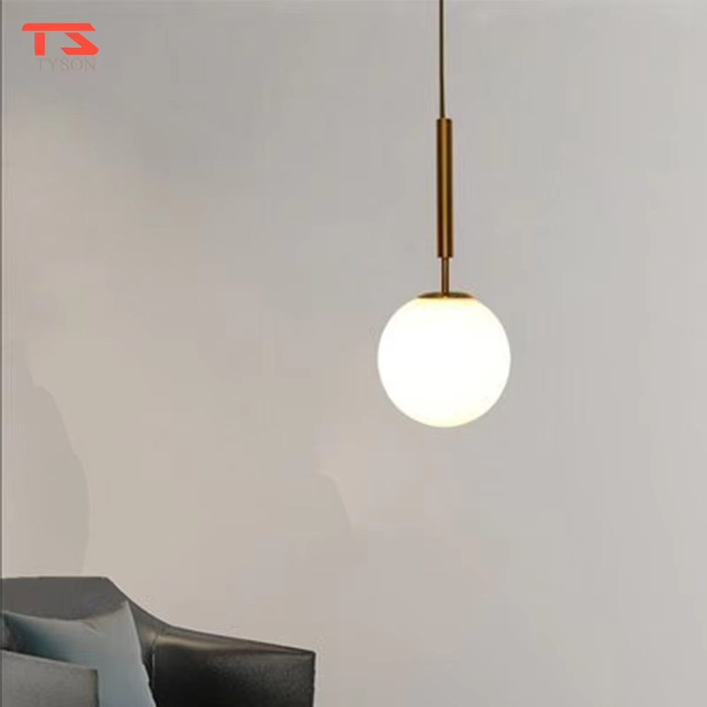 Minimalist golden ball glass chandelier (gold pole + milk white glass ball), warm light effect, creating a simple and high-end warm space atmosphere.