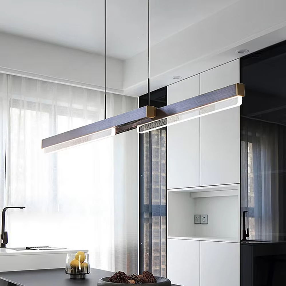 This is a modern minimalist style linear chandelier, featuring a walnut texture panel paired with brass metal accents. The linear lighting design emits soft and uniform light, serving both practical lighting and space decoration purposes, suitable for dining rooms, open kitchens, light luxury bars, modern office areas and other scenarios.