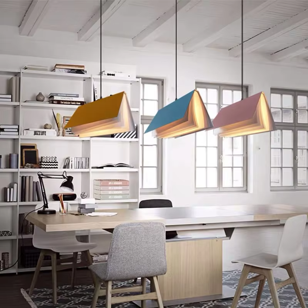 Creative origami book-shaped colorful hanging chandelier, folded structure + multi-color appearance (orange/pink/white/blue, etc.), soft and warm lighting, creating a literary creative atmosphere.