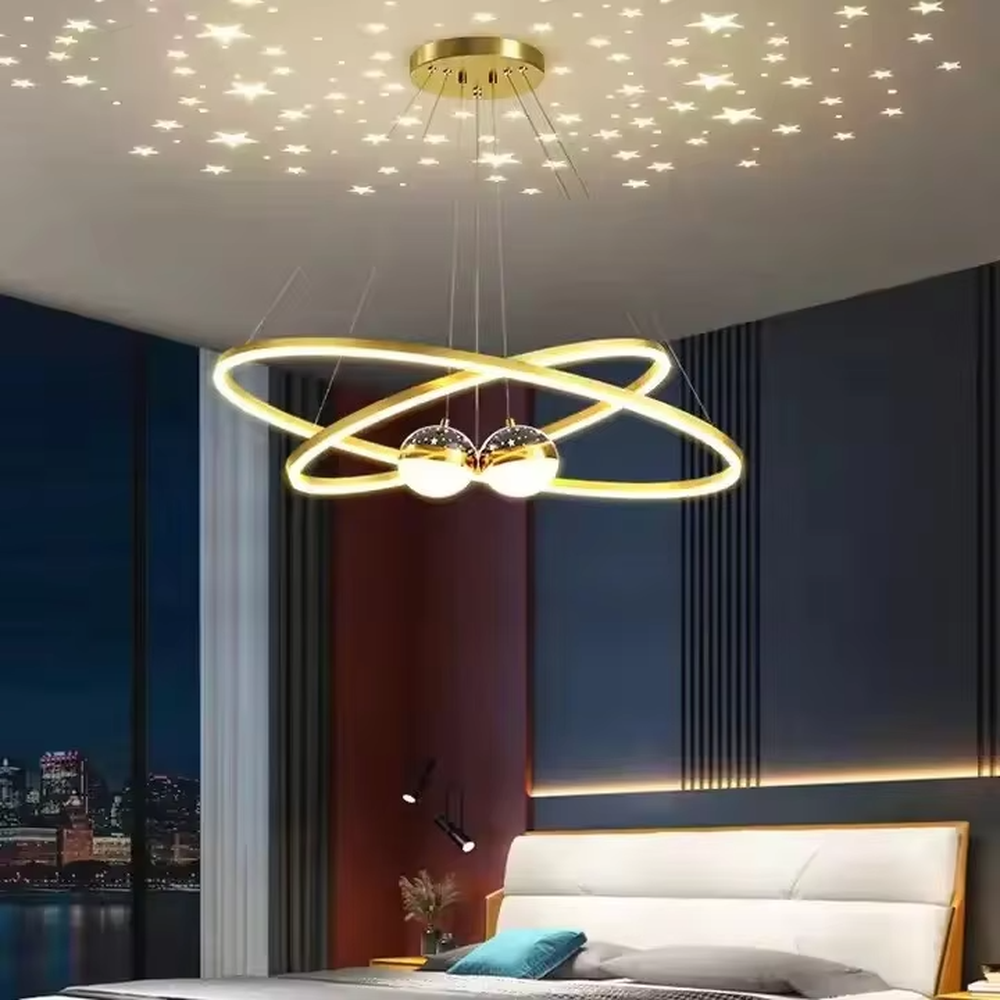 This modern light luxury galaxy-shaped chandelier features multi-layer interlaced ring light strips made of black and gold metal, paired with spherical crystal lamp shades, and has a built-in star and moon projection effect on the top. It serves both lighting and decorative purposes, ideal for modern home spaces such as living rooms and dining rooms, as well as light luxury commercial venues.