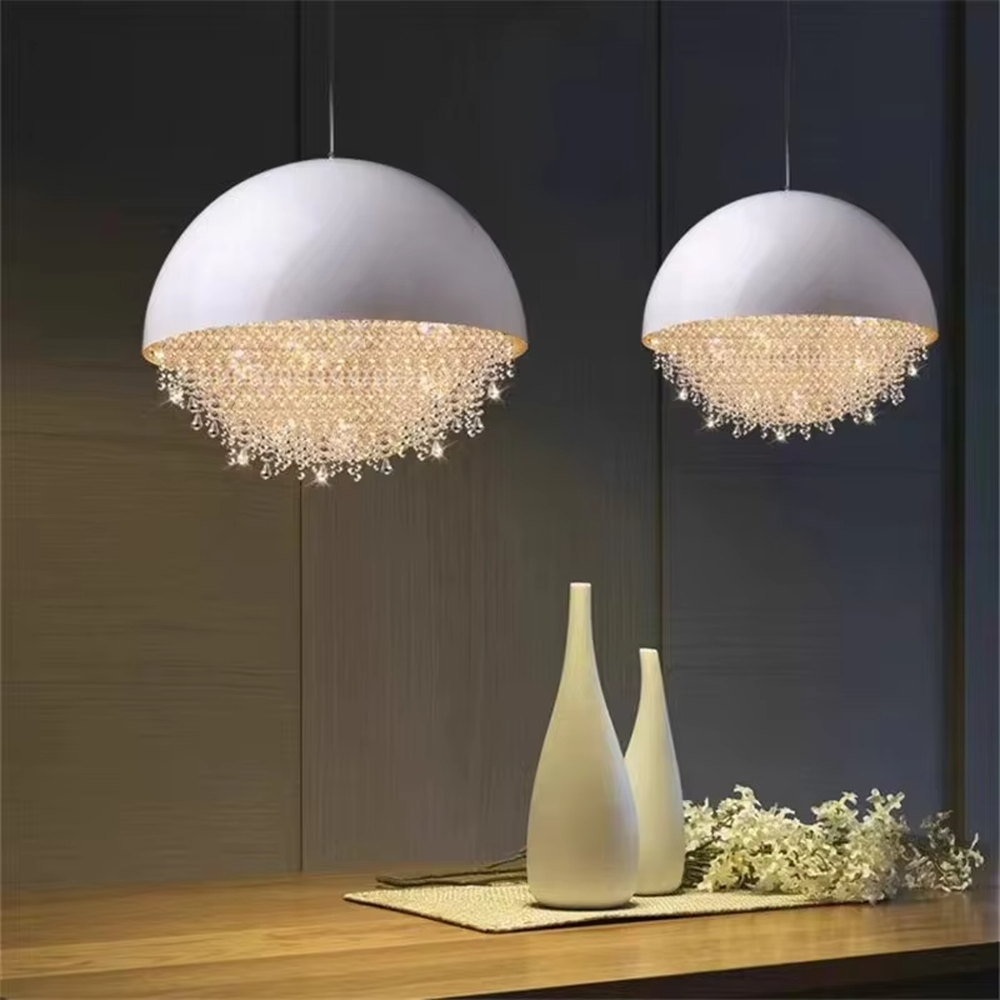 This modern light luxury hemispherical chandelier features a white metal upper cover, with dense crystal decorations along the lower edge like a falling waterfall. It serves both lighting and decorative purposes, ideal for dining rooms, living rooms, light luxury commercial spaces and other scenarios.