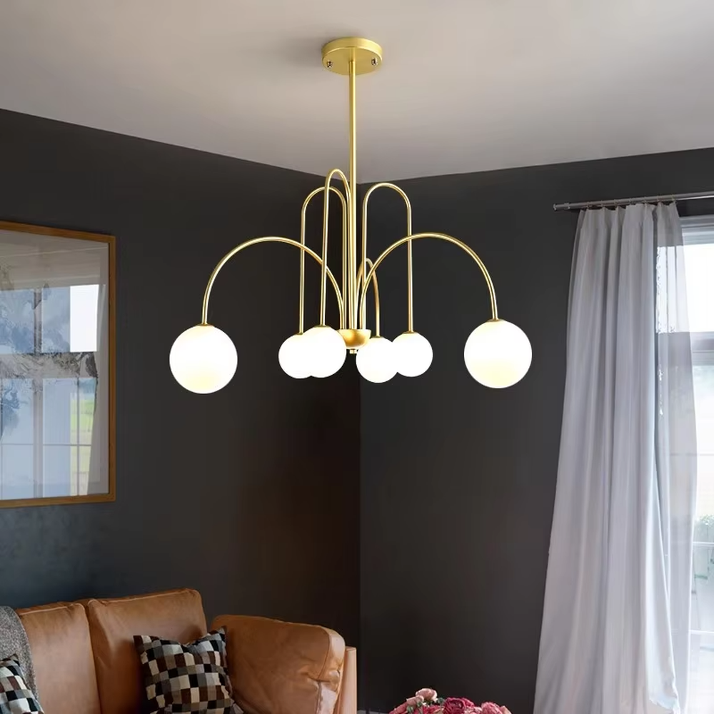 Light luxury gold arc glass ball chandelier (gold arc frame + milk-white glass balls), warm light effect, creating a soft and high-end home atmosphere.