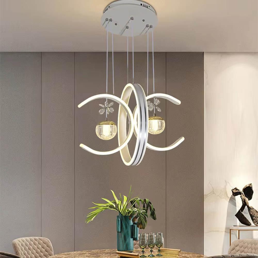 This modern light luxury chandelier features interlaced ring-shaped LED bodies and spherical crystal lamp shades with dragonfly decorations. It has smooth, layered lines, serves both lighting and decorative purposes, and is ideal for modern home spaces like dining rooms and living rooms, as well as light luxury commercial venues.