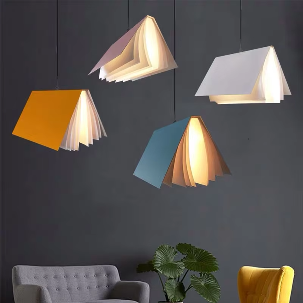 Creative origami book-shaped colorful hanging chandelier, folded structure + multi-color appearance (orange/pink/white/blue, etc.), soft and warm lighting, creating a literary creative atmosphere.