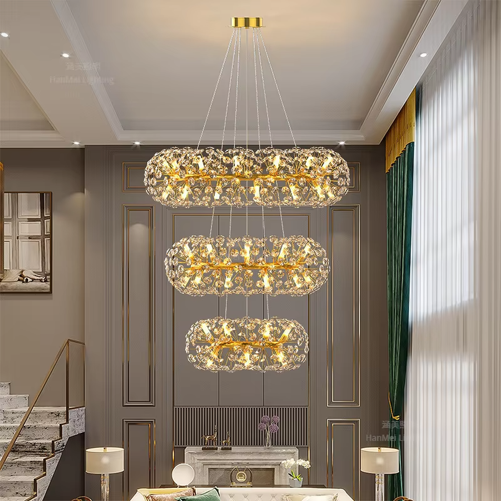 Light luxury oval dandelion-shaped golden frame crystal chandelier, warm light effect, creating an exquisite artistic space atmosphere.