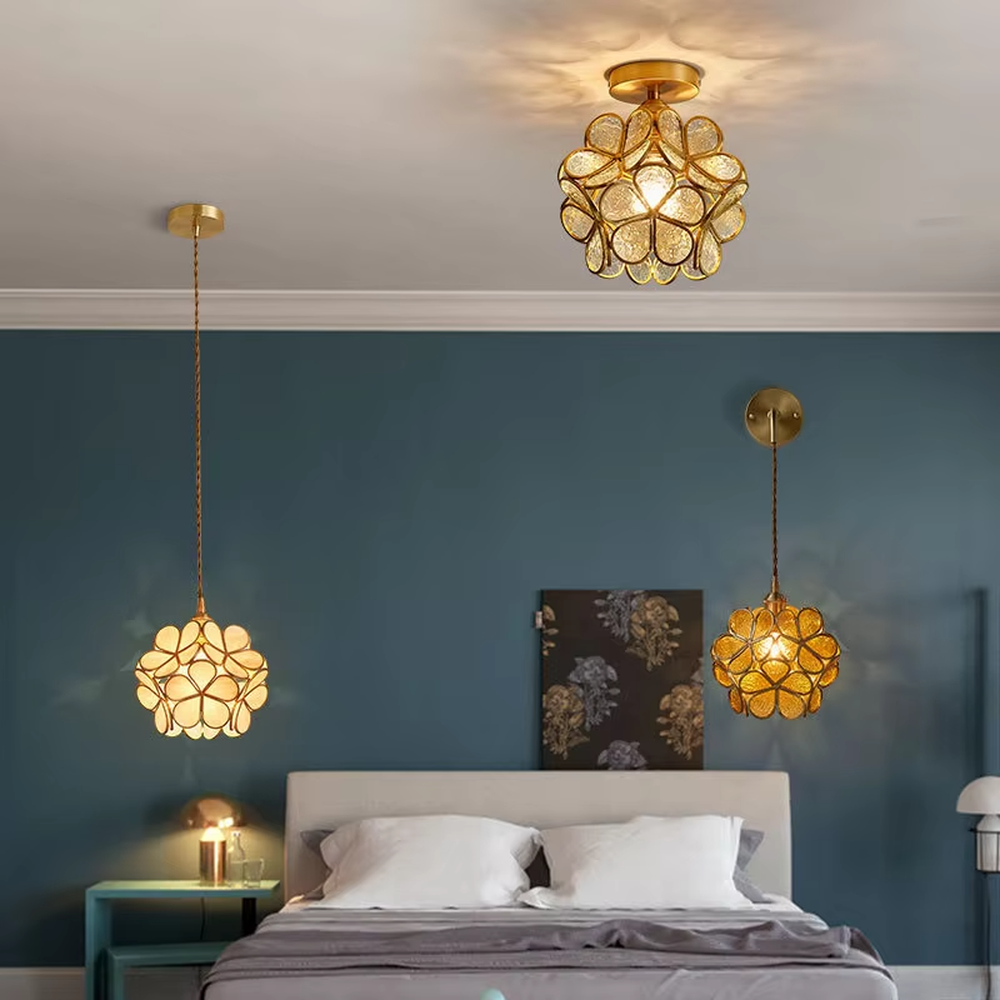 Retro light luxury petal spherical chandelier, golden metal petal frame + textured transparent glass panels + jute rope hanger, soft warm light with textured light and shadow, creating a warm artistic atmosphere.