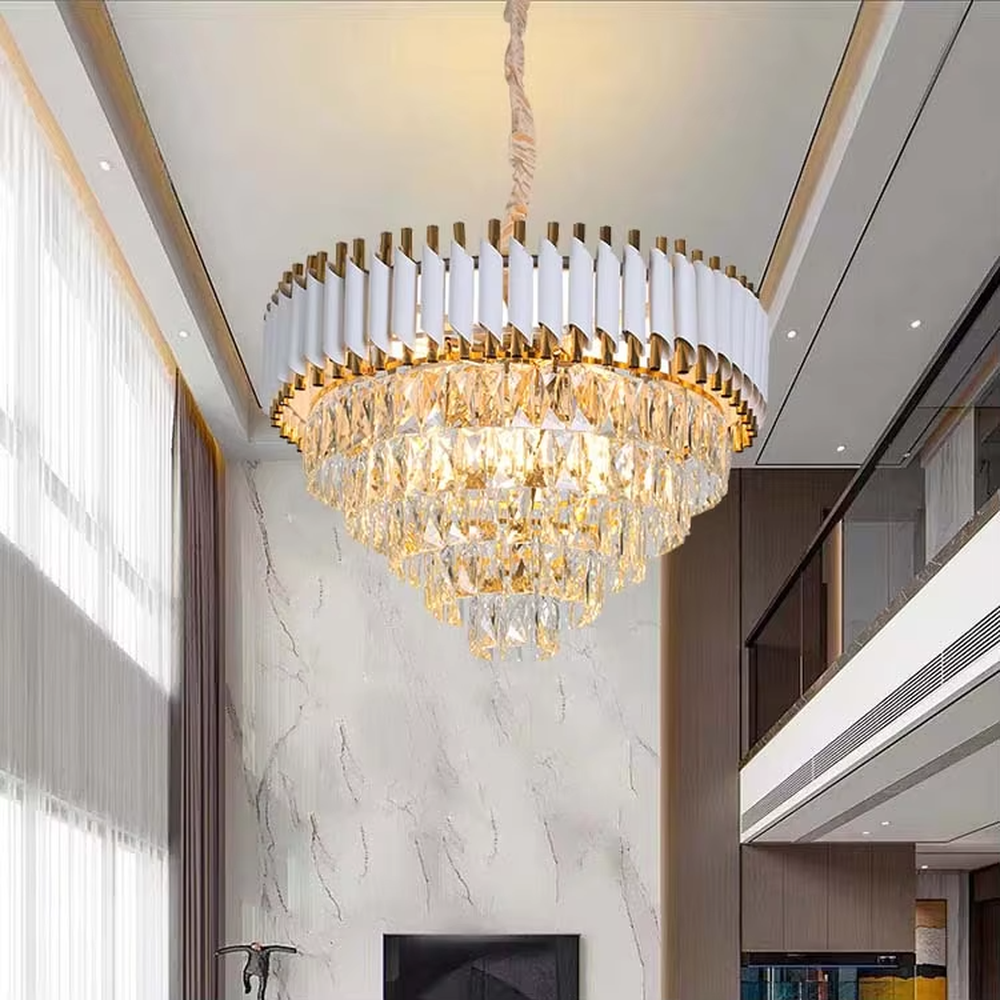This is a modern luxurious white and gold multi-layer crystal chandelier, with white and gold top decorations paired with numerous transparent crystal pendants. It features a grand and luxurious design with brilliant lighting. It is used for space lighting and decoration, creating a luxurious high-end atmosphere. Suitable for light luxury-style living rooms, high-ceiling spaces in luxury villas, high-end hotel lobbies and other places.