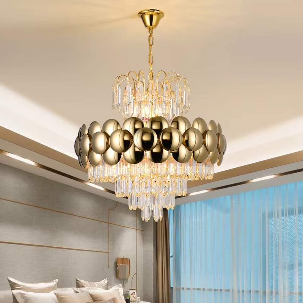 This is a luxurious modern-style golden spherical crystal multi-layer chandelier, combining golden metal spherical elements with multi-layer crystals. It features a grand and luxurious design with brilliant lighting. It is used for space lighting and decoration, creating a high-end luxurious atmosphere. Suitable for light luxury-style restaurants, luxury living rooms, high-end hotel banquet halls and other places.