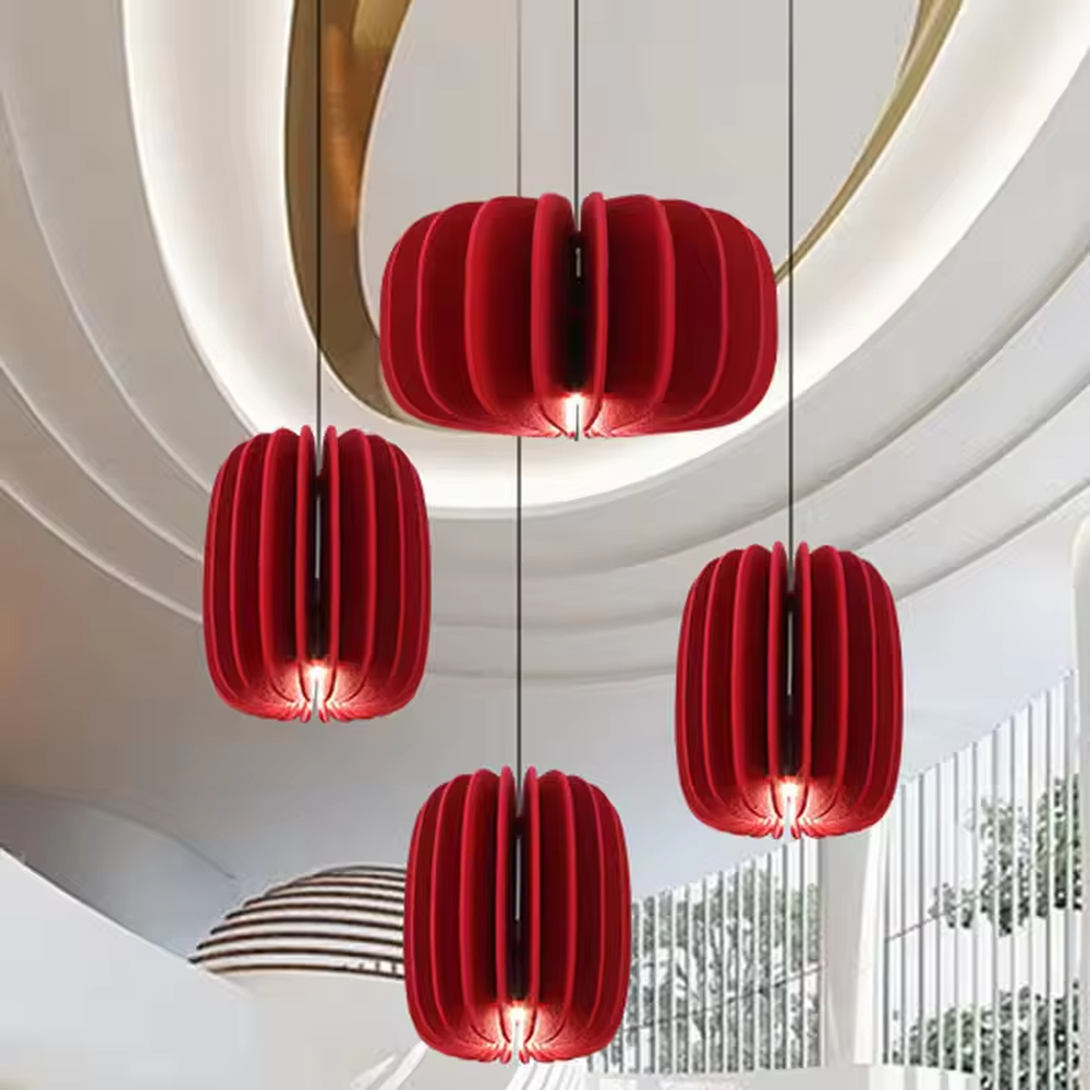Modern artistic red pleated petal-shaped hanging chandelier, soft fabric material, soft and warm lighting, creating a stylish artistic atmosphere.