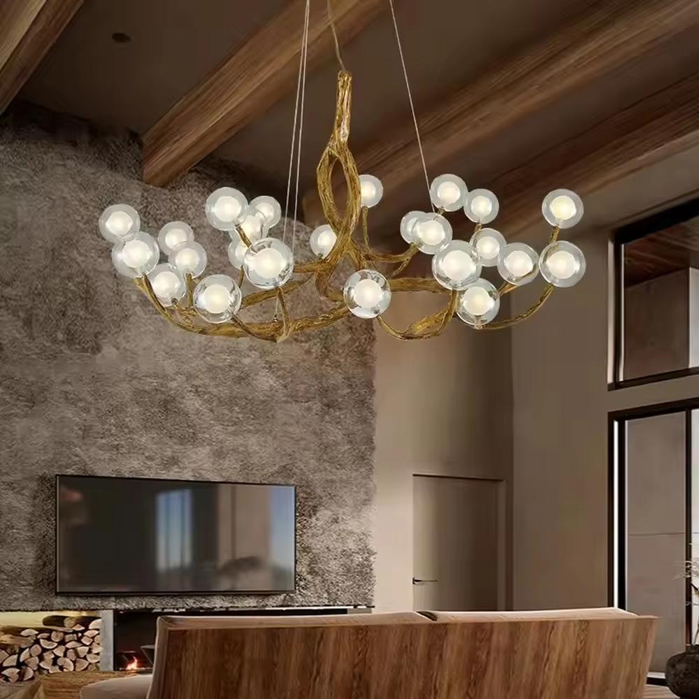 This is a luxury natural-style branch-shaped chandelier with golden metal branch-like brackets and multiple transparent spherical lampshades. It features a highly artistic design with a natural luxury ambiance. It is used for space lighting and decoration, creating a natural artistic visual focus. It is suitable for luxury-style home living rooms, art villa spaces, high-end music rooms and other places.
