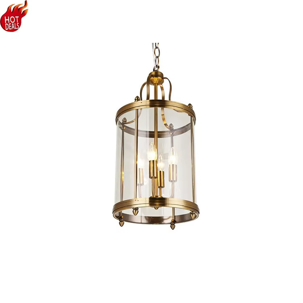 Light luxury golden metal cage-style cylindrical glass cover candelabra chandelier, golden frame + transparent cylindrical glass cover + candle-shaped bulbs, soft warm light, suitable for modern minimalist dining area atmosphere.