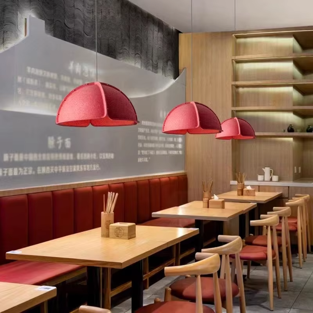 This is a modern minimalist gray spliced dome chandelier, with a gray spliced dome shape, metal rivet details, and an inner warm light design, featuring a minimalist and grand style. It is used for space lighting and decoration, creating a warm and modern atmosphere. Suitable for modern minimalist living rooms, Nordic-style restaurants, creative office areas and other places.