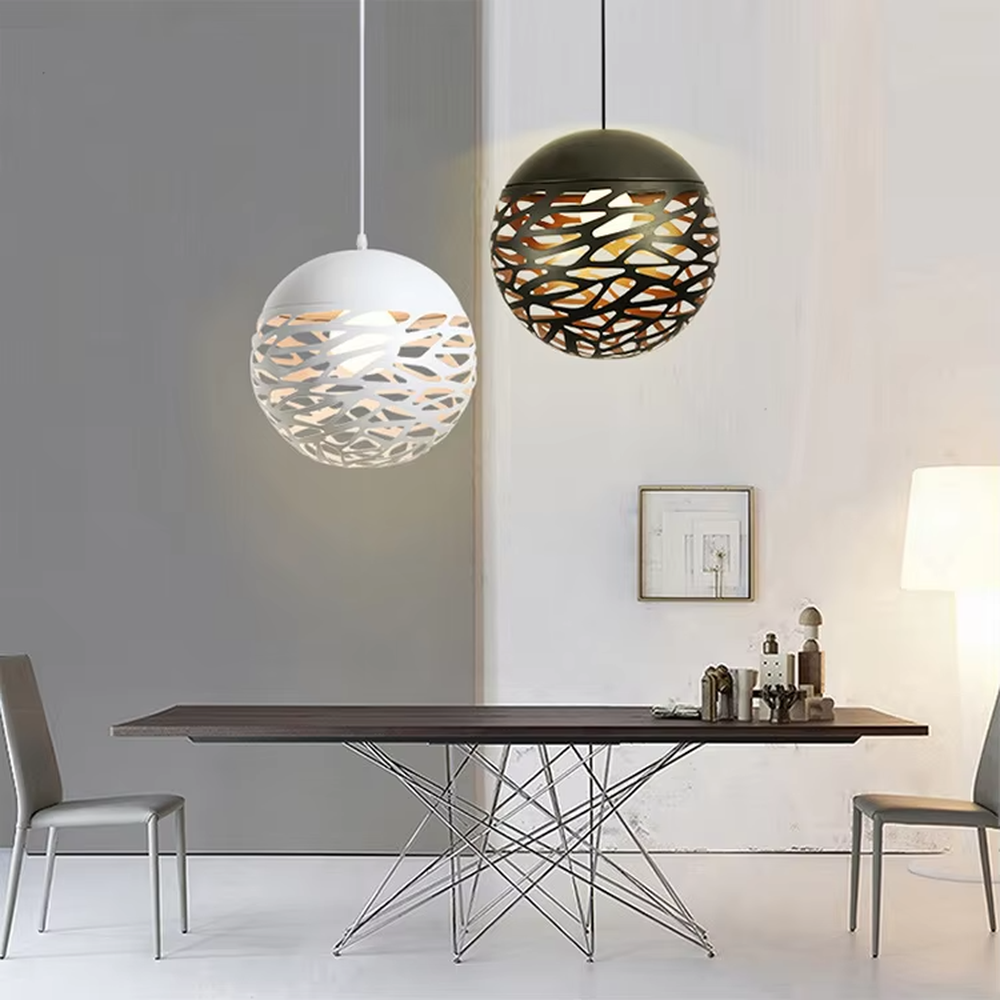 This minimalist hollow spherical chandelier features irregular hollow textures made of metal, available in black and white color options. It emits soft diffused light when lit, serving both lighting and decorative purposes, ideal for dining rooms, living rooms, modern homes and other scenarios.
