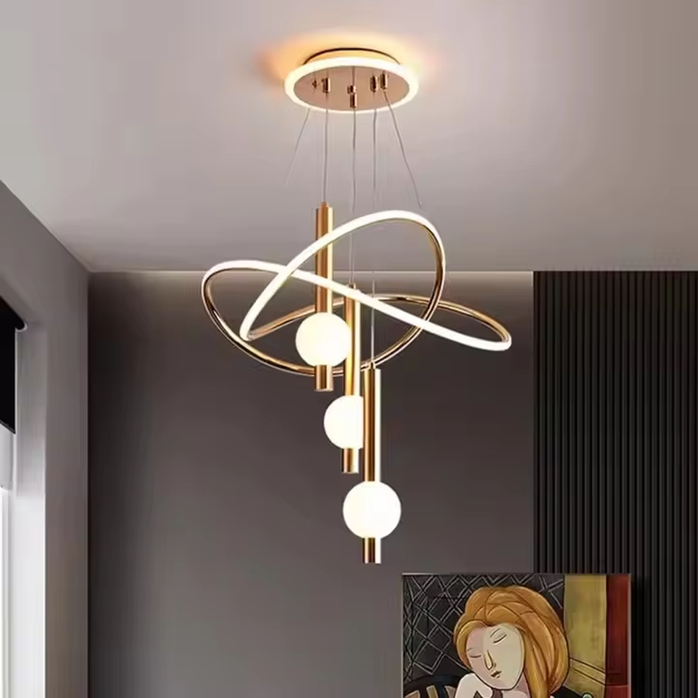 This is a modern creative cross-ring spherical chandelier, featuring white cross-ring light strips paired with spherical lamp bodies. The design is simple and artistic, with soft and uniform lighting. It is used for space lighting and decoration to create a modern artistic atmosphere. Suitable for modern-style living rooms, minimalist dining areas, modern apartments and other places.