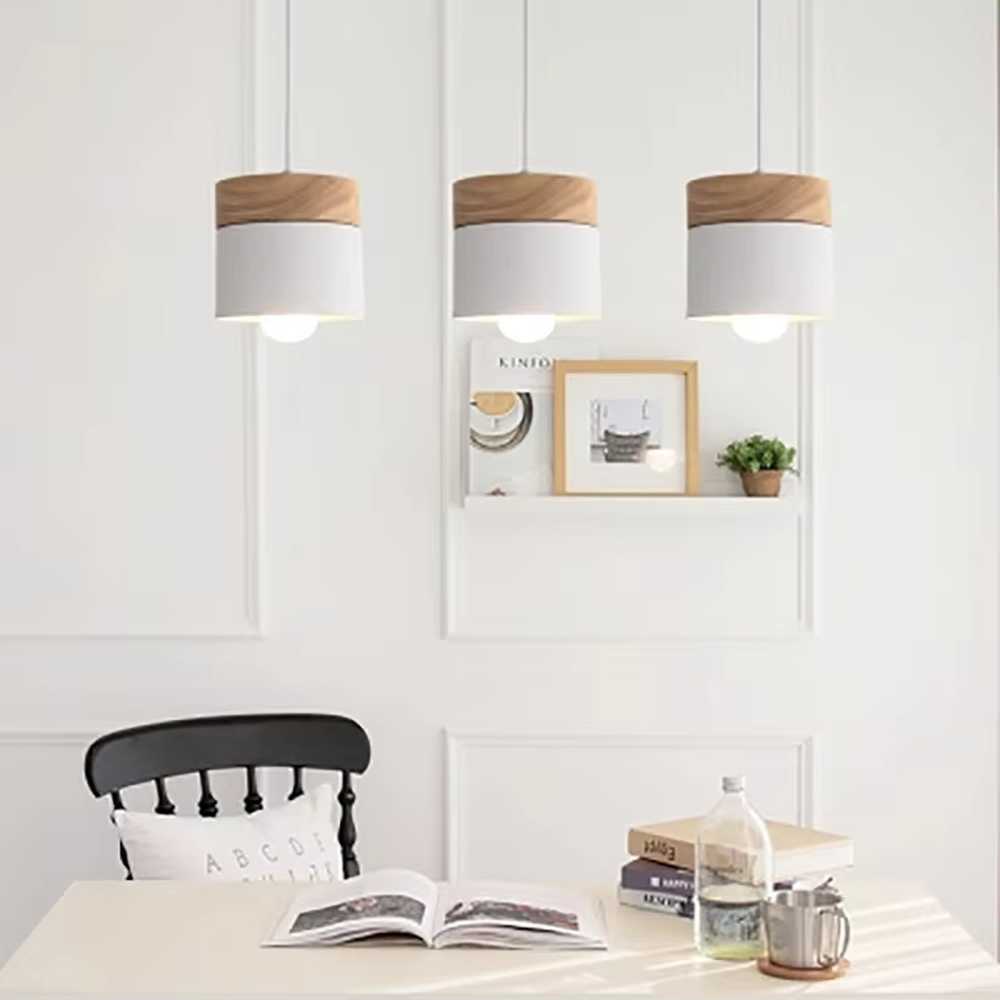 Minimalist black-wood cylindrical double-unit hanging lamp, black cylindrical lampshade + wooden top decoration + thin suspension rope, soft and uniform light, creating a simple natural home atmosphere.