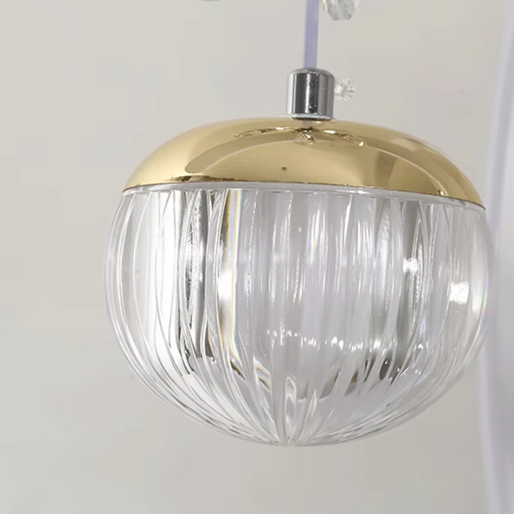 This modern light luxury chandelier features interlaced ring-shaped LED bodies and spherical crystal lamp shades with dragonfly decorations. It has smooth, layered lines, serves both lighting and decorative purposes, and is ideal for modern home spaces like dining rooms and living rooms, as well as light luxury commercial venues.