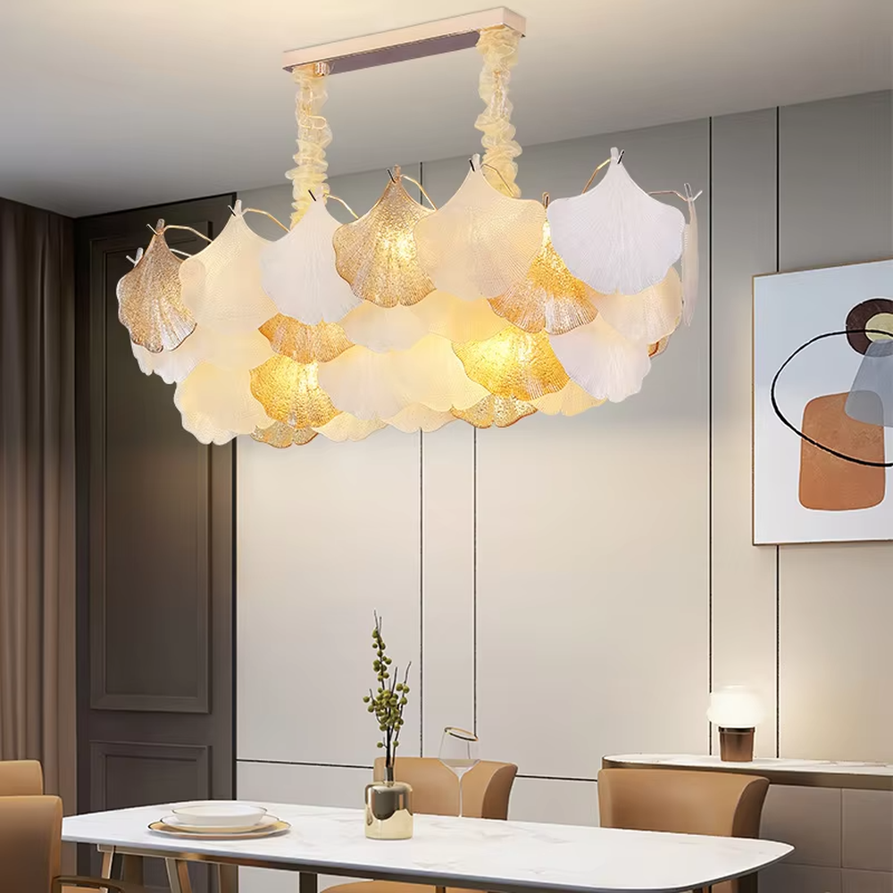 This is an artistic ginkgo leaf-shaped ceiling lamp, featuring gradient (off-white to light gold) textured leaf-shaped lampshades paired with golden metal connectors. The lighting is soft and warm, creating a natural and elegant space atmosphere.
