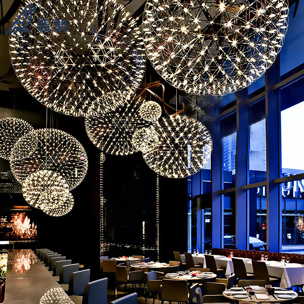 Art spark ball dandelion chandelier (metal woven spherical frame + built-in LED light source), warm/cool light effect, creating a dreamy and bright high-ceiling space atmosphere.