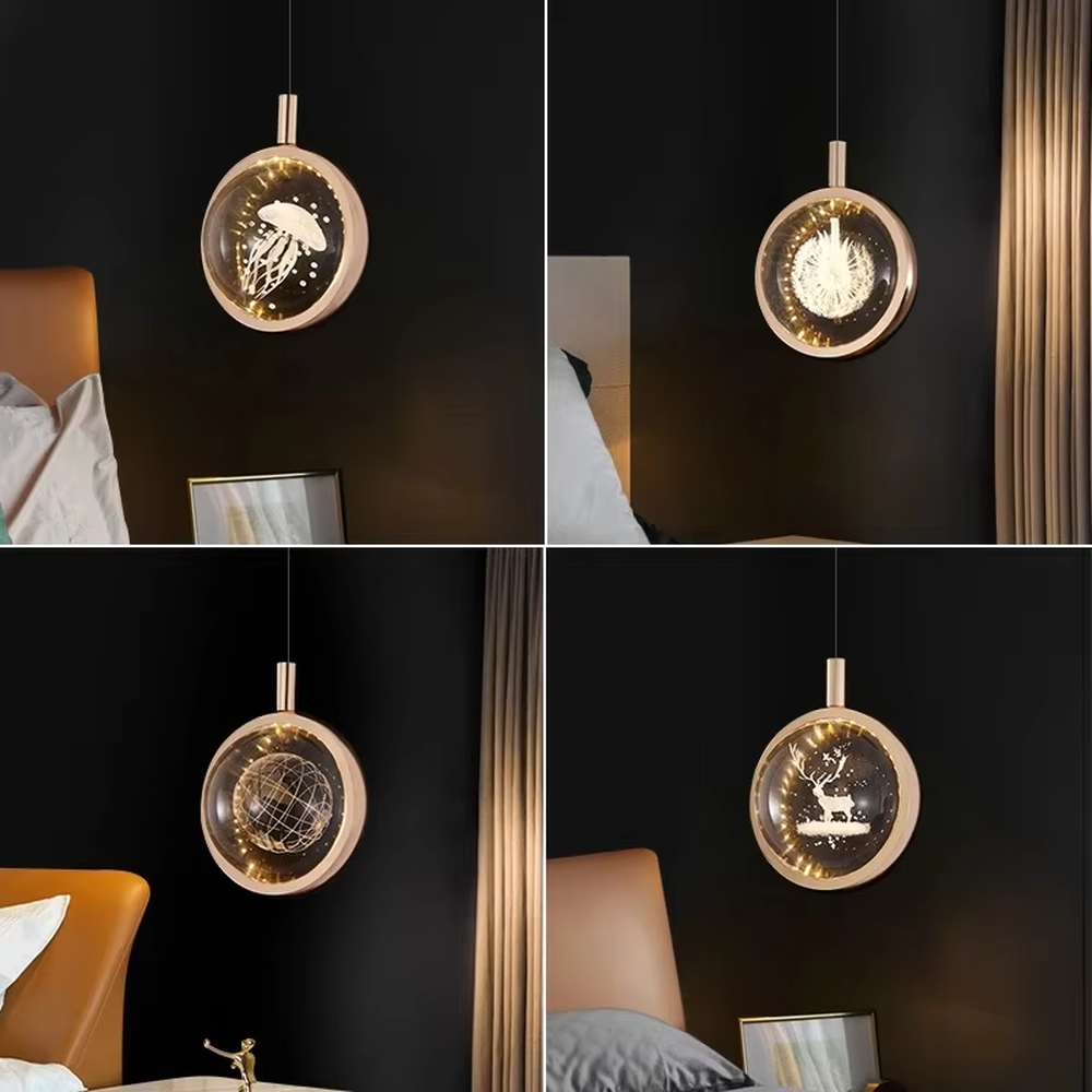 This light luxury small round chandelier features a gold metal frame, a transparent panel with delicate patterns such as jellyfish/birds, and projects ripple light and shadow on the wall when lit, serving both lighting and decorative purposes, ideal for bedroom bedside tables, light luxury homestays, high-end hotel rooms and other spaces.