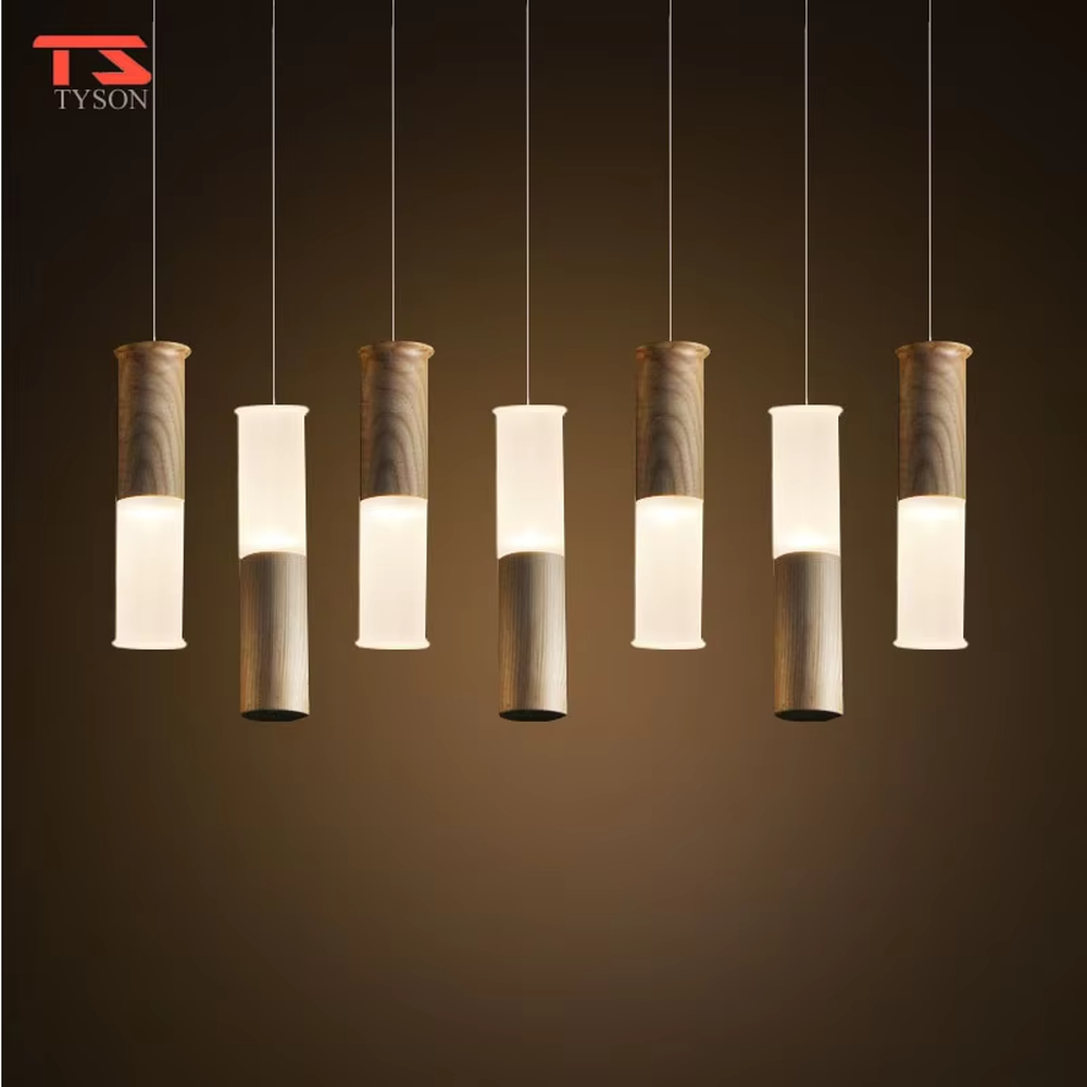 Natural minimalist wood and frosted glass cylinder multi-head pendant light, warm light effect, creating a natural cozy atmosphere.