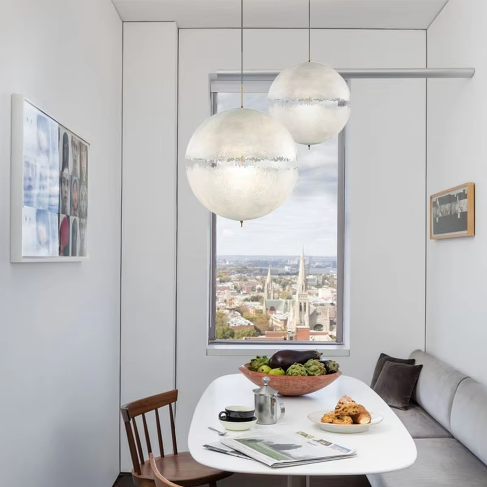 Modern art-style multi-head frosted spherical chandelier, water-textured white shade + black-gold decoration + warm light effect, creating a fresh artistic atmosphere in public spaces.