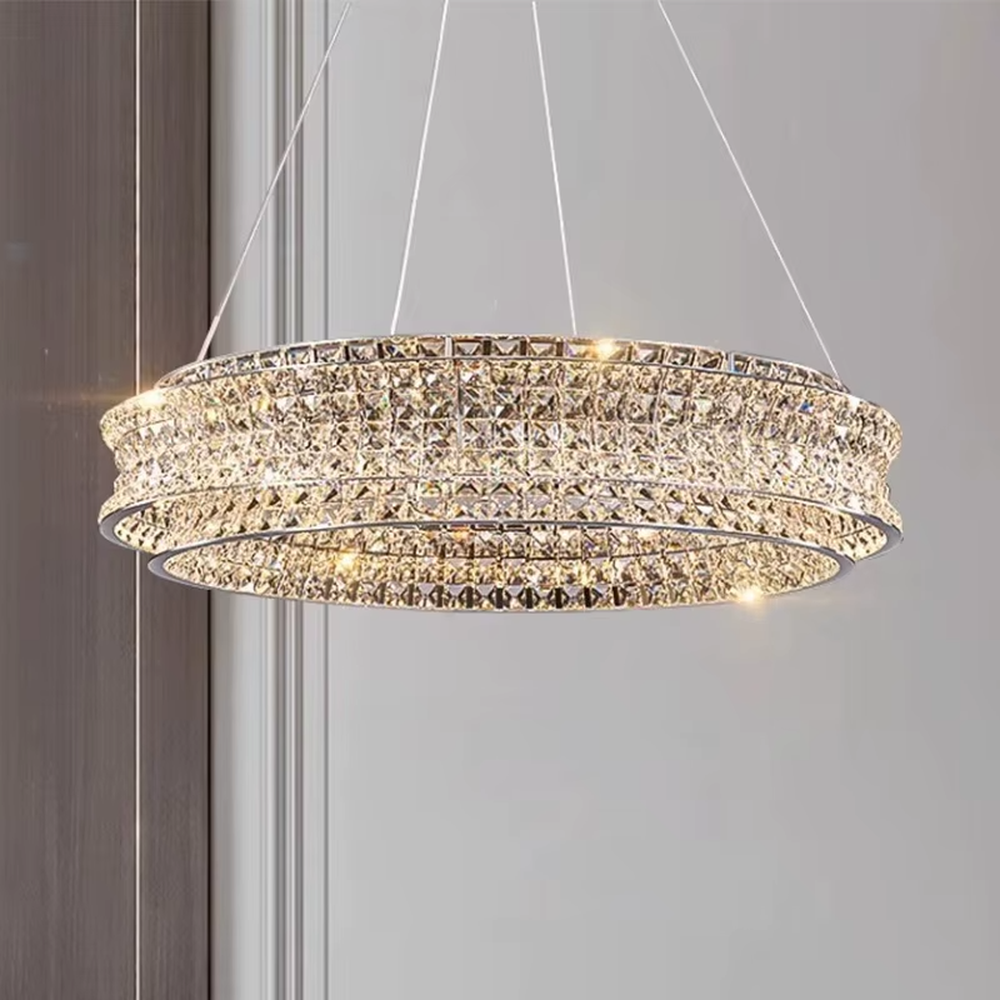 This is a light luxury and luxurious double-layer ring crystal chandelier, with a double-layer ring shape full of crystals. When lit, the light is brilliant and gorgeous, creating a high-end luxurious atmosphere.