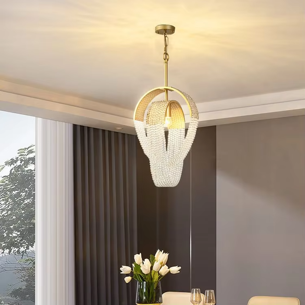 Light luxury golden frame pearl string bud-shaped chandelier, warm light effect, creating an exquisite and soft space atmosphere.