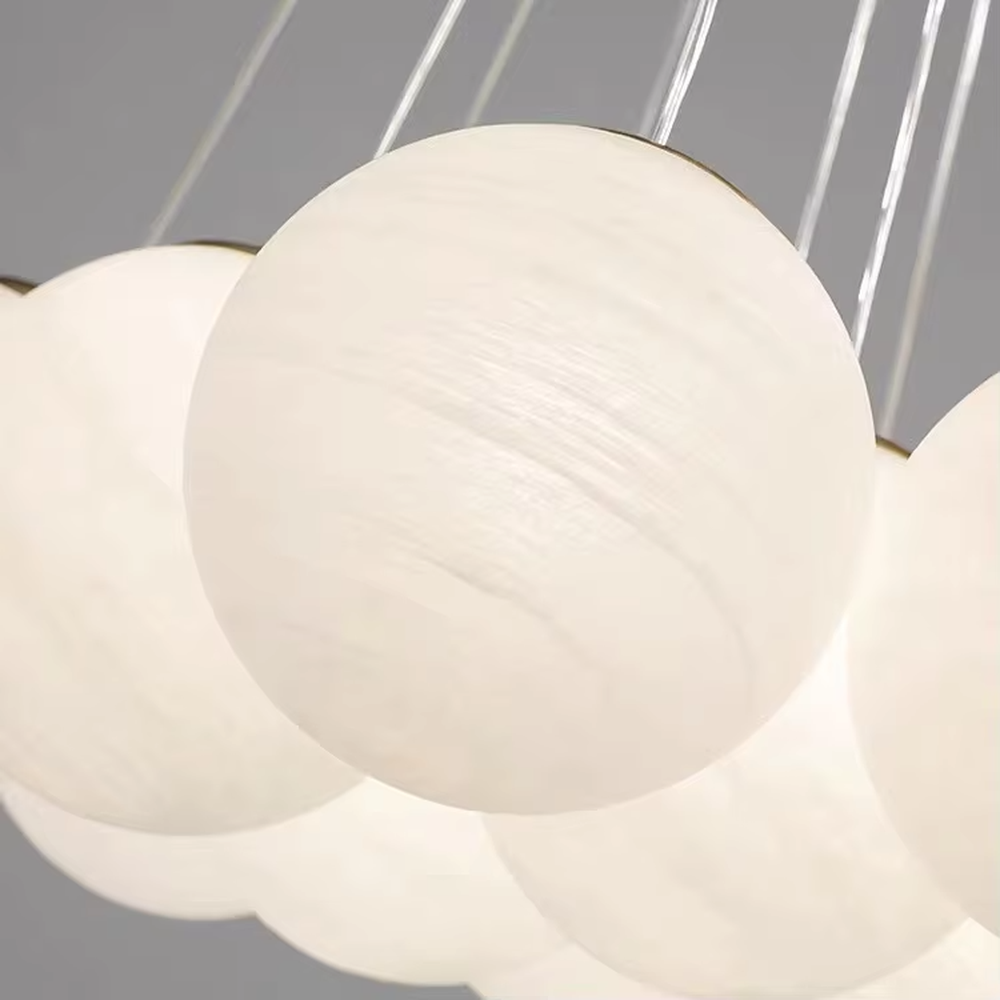 Light luxury cloud cluster glass ball chandelier (milk-white glass balls + gold wire frame), warm light effect, creating a soft and healing light luxury space atmosphere.