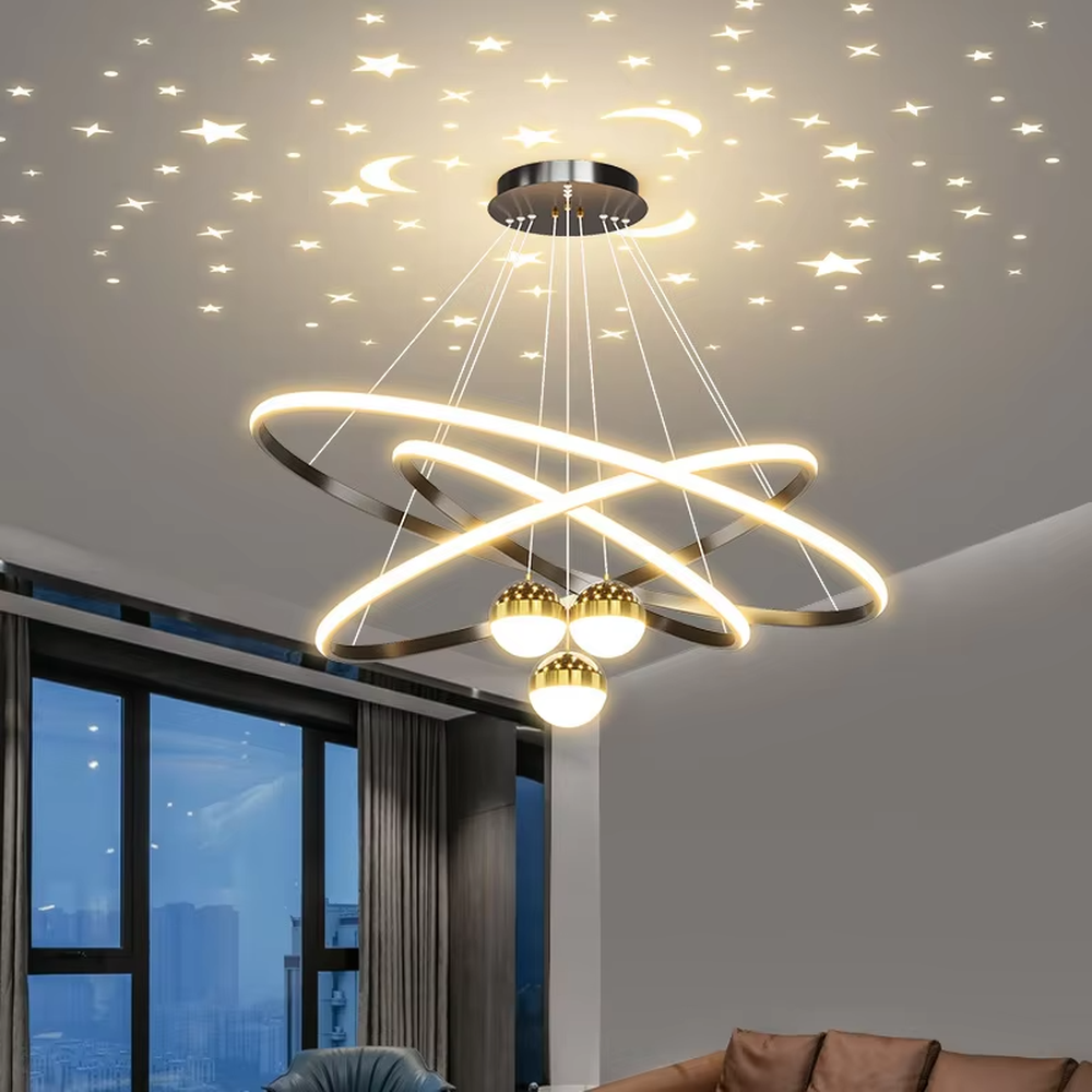 This modern light luxury galaxy-shaped chandelier features multi-layer interlaced ring light strips made of gold metal, paired with spherical crystal lamp shades, and has a built-in starry sky projection effect on the top. It serves both lighting and decorative purposes, ideal for modern home spaces such as living rooms and dining rooms, as well as light luxury commercial venues.