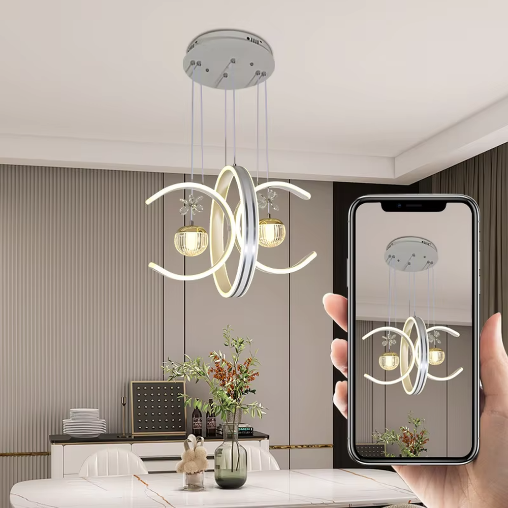 This modern light luxury chandelier features interlaced ring-shaped LED bodies and spherical crystal lamp shades with dragonfly decorations. It has smooth, layered lines, serves both lighting and decorative purposes, and is ideal for modern home spaces like dining rooms and living rooms, as well as light luxury commercial venues.