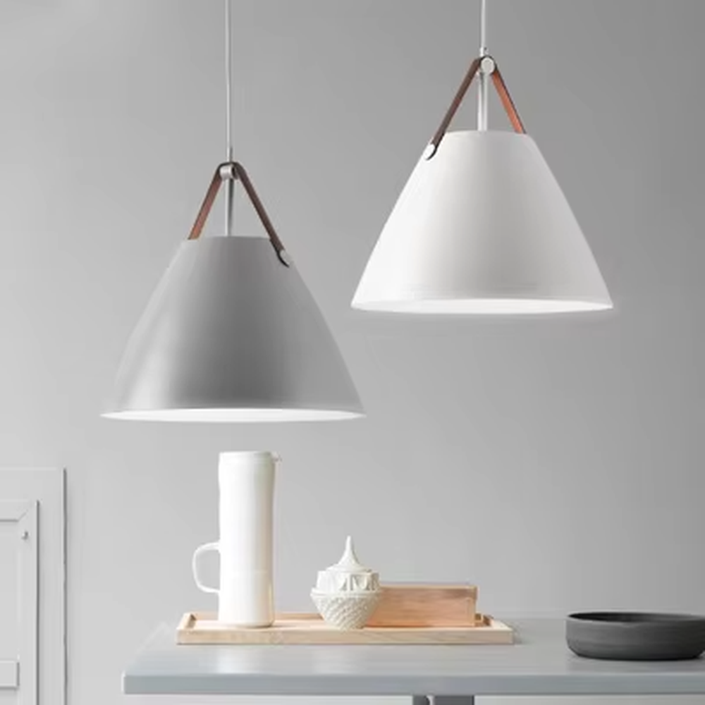 This set of Nordic-style glass lighting includes a table lamp and a chandelier, with drum-shaped lampshades made of blue-gray gradient glass. The table lamp is paired with a black tripod base, and the chandelier uses a suspension design, emitting soft and transparent light, serving both lighting and decorative purposes, ideal for bedrooms, dining rooms, Nordic-style homes and internet-famous shops and other scenarios.