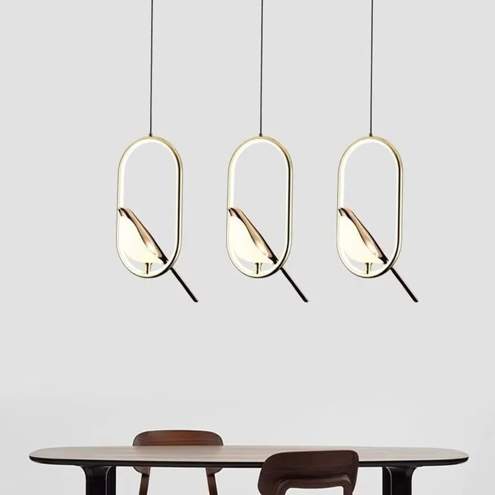 This modern minimalist chandelier features a black metal oval frame, paired with a beveled gold decorative piece and soft LED light source. It has a minimalist and design-conscious shape, serving both lighting and decorative purposes, ideal for modern minimalist spaces such as bedroom bedside tables, living room side tables, and hotel guest rooms.