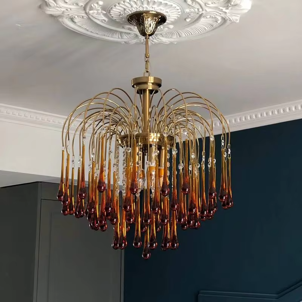 Vintage light luxury golden metal wireframe amber waterdrop glass chandelier, warm light effect, creating a cozy vintage luxurious atmosphere.